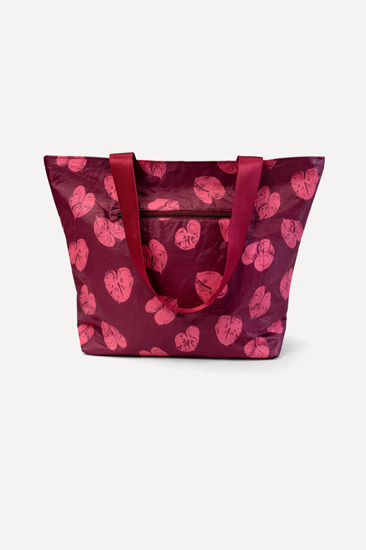 Front view of the Coconut Ave Large Hele Tote – Na Puʻuwai showcasing its spacious design and exclusive Hawaiian-inspired print.