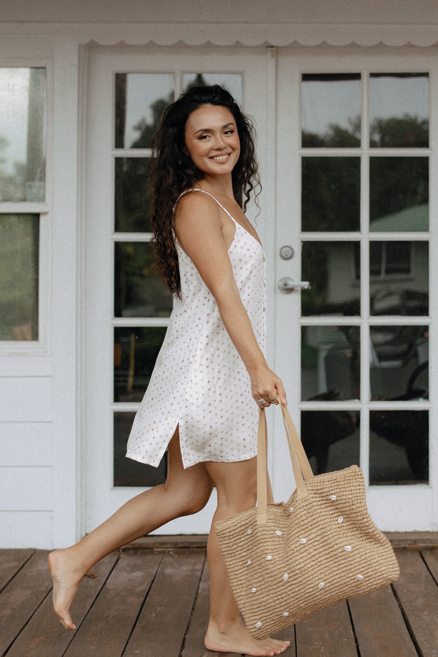 Puka Shell Day Tripper Dress styled with sandals and a woven tote for a relaxed beach vacation outfit.