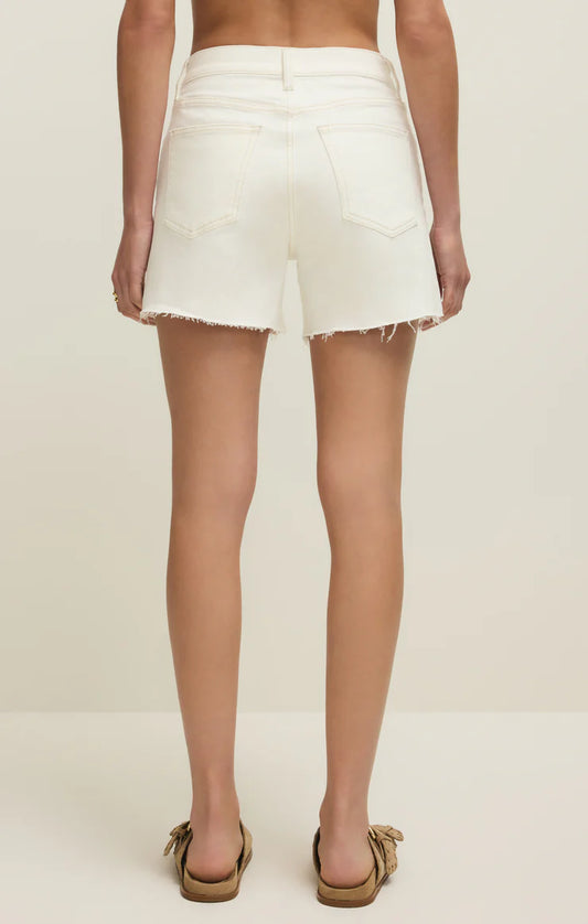 Back view of the Jonah Mid-Rise Short in Cloud showing the off-white denim fabric and five-pocket design.