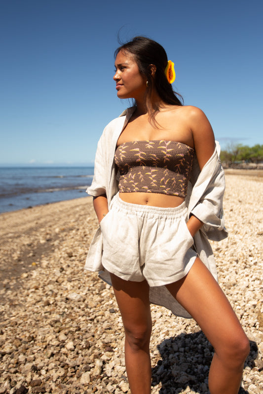 Woman wearing the Playa Short in Flax with the matching Smocked Tube Top.
