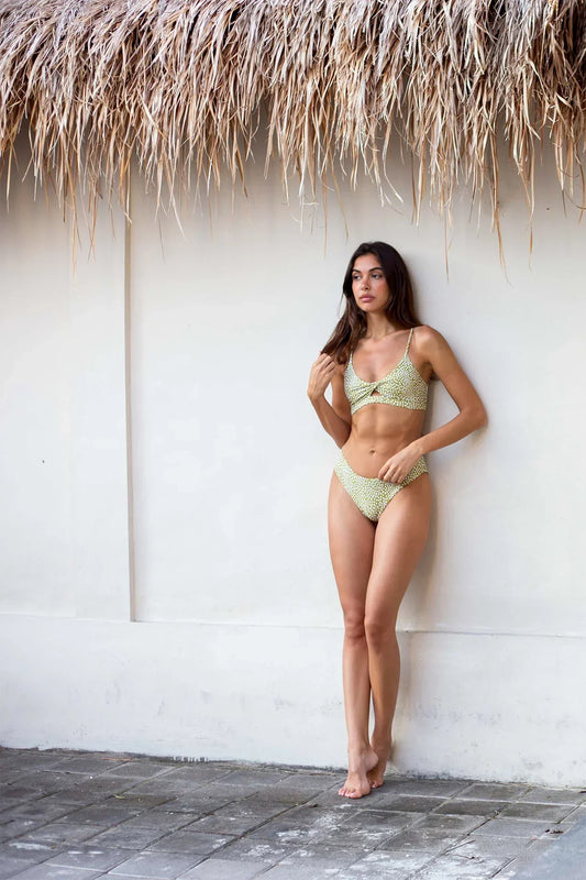 Woman wearing the Coconut Ave Moray bikini, inspired by Hawaiʻi's natural beauty and designed for beach vacations, tropical getaways, and island style.