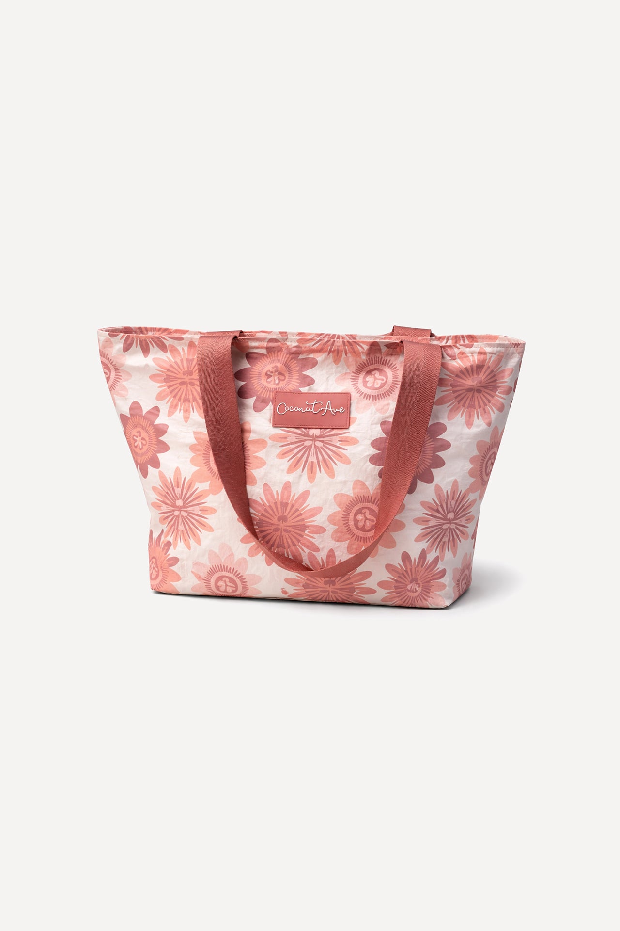 Coconut Ave Hele Tote in Lilikoʻi Blooms print made from splash-proof Tyvek® with reinforced shoulder straps.