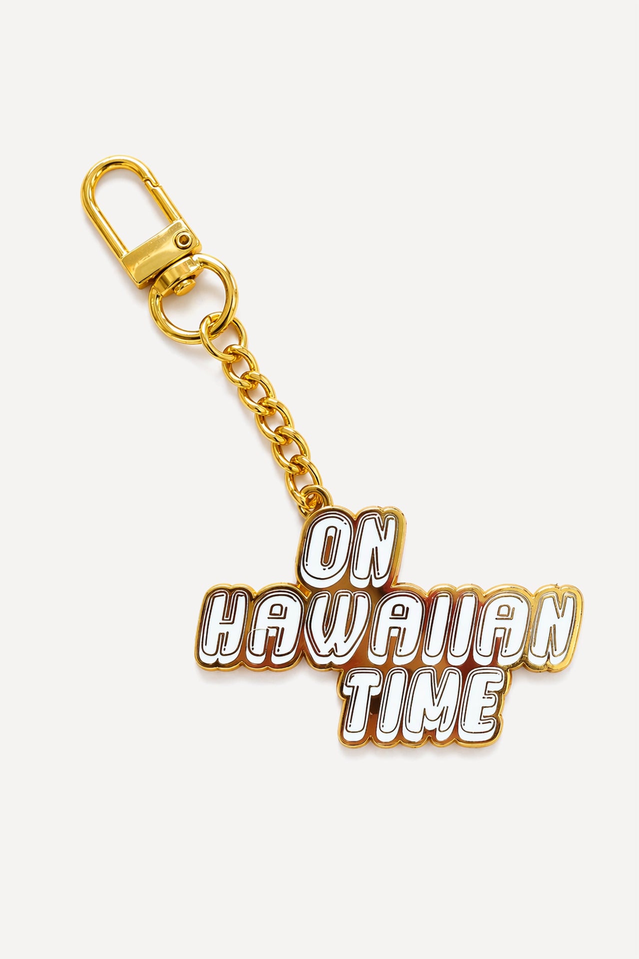 On Hawaiian Time keychain featuring a hand-drawn design inspired by an iconic Hawaiian saying.