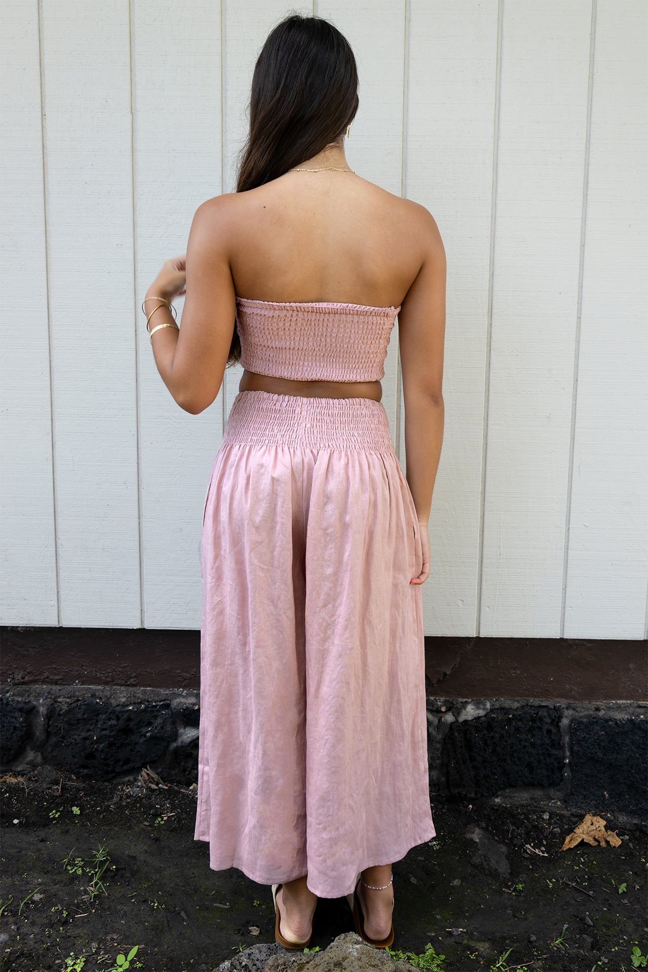 Rear view of the Coconut Ave Dreamweaver Pant in Rosey highlighting the smocked waistband.