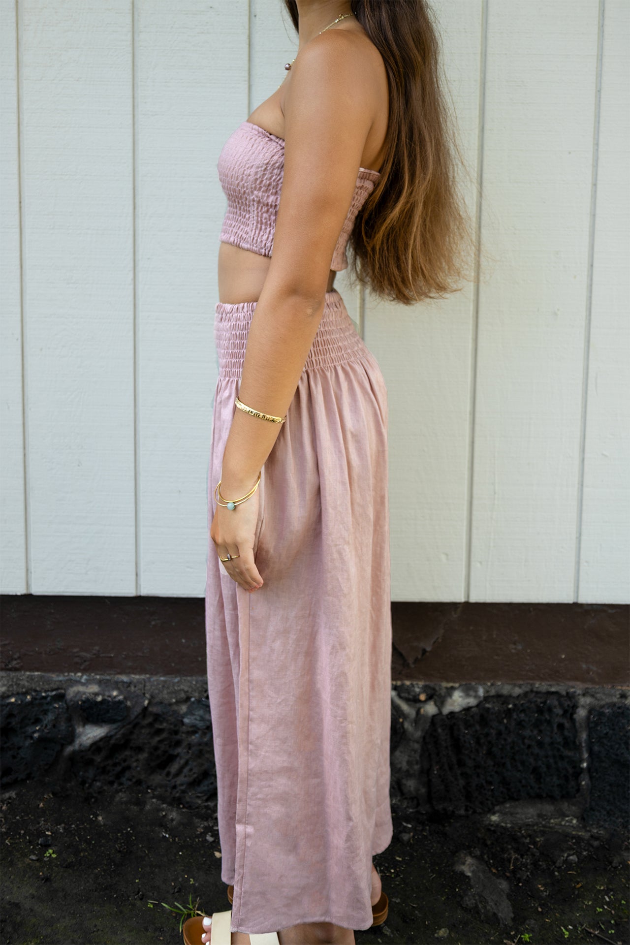 Side view of the Coconut Ave Dreamweaver Pant in Rosey featuring a relaxed wide-leg silhouette.