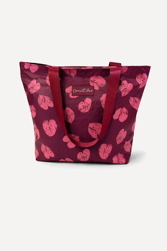 Coconut Ave Large Hele Tote in the exclusive Na Puʻuwai print featuring durable splash-proof Tyvek construction and reinforced shoulder straps.