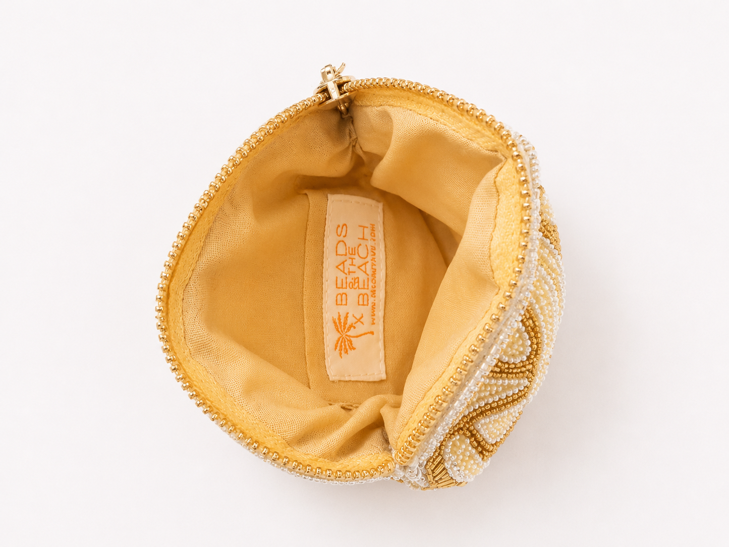 Open Coconut Ave Shell Coin Purse showing the interior logo detail and convenient card pocket.