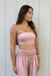 Woman wearing the Coconut Ave Smocked Tube Top in Rosey with the matching Dreamweaver Pant.