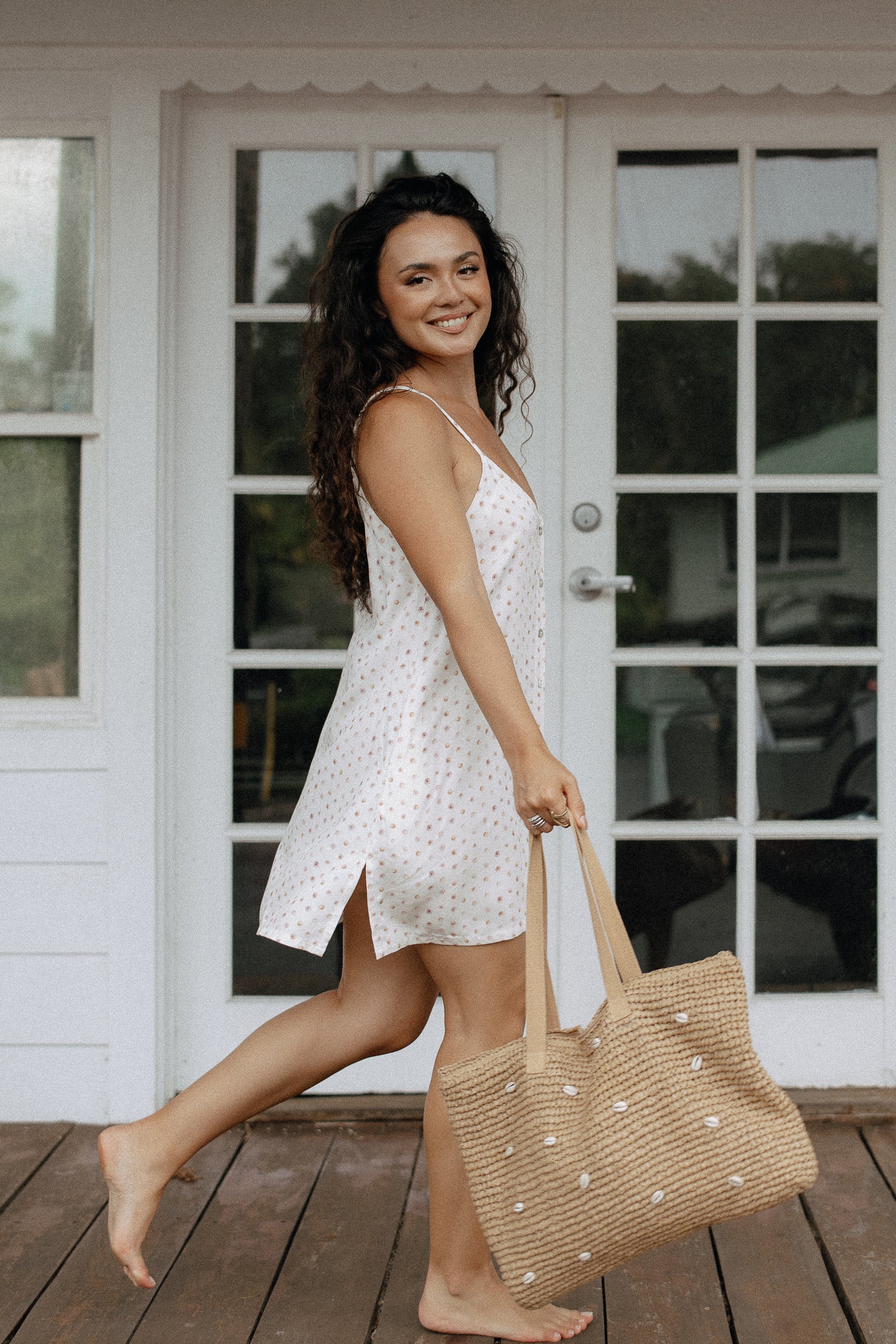 Puka Shell Day Tripper Dress styled with sandals and a woven tote for a relaxed beach vacation outfit.