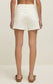 Back view of the Jonah Mid-Rise Short in Cloud showing the off-white denim fabric and five-pocket design.
