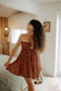 Chocolate Bloom Mau'umae Mini Dress styled as an easy warm-weather look, perfect for a summer outing.