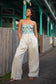 Full-length view of the Paloma Pant in Flax styled for resort wear.