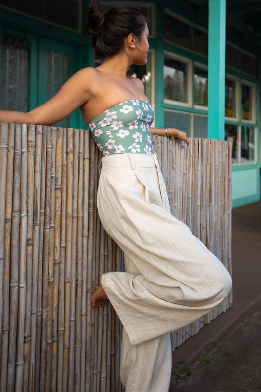 Model wearing the Coconut Ave Paloma Pant in Flax with a matching floral top.