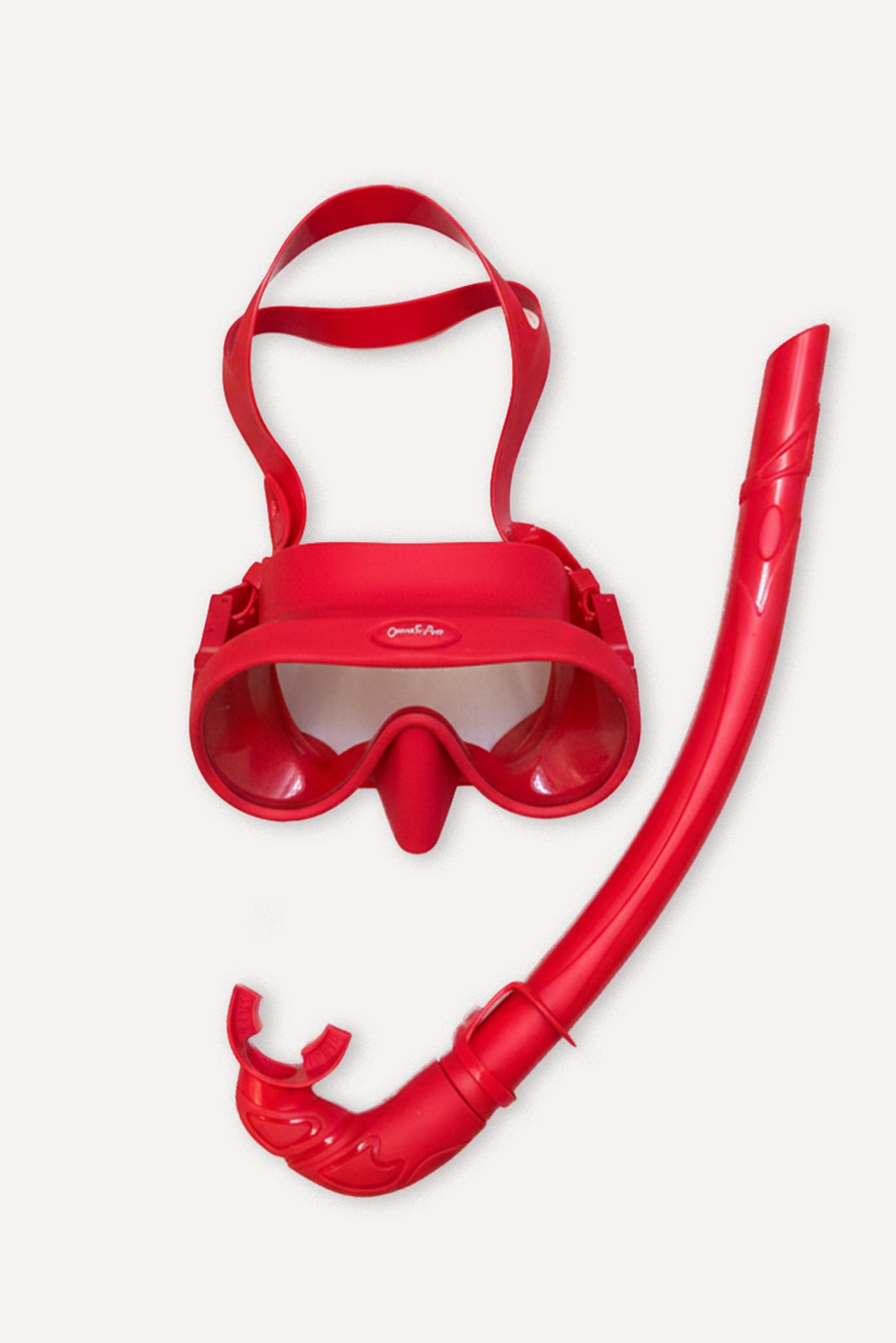 Red silicone mask and snorkel set with tempered glass lenses.