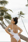 Back and side view of the Stevie One Piece in Hulali print by the beach