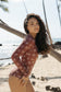 Side view of the Surf Suit in Chocolate Bloom showing the fitted one-piece silhouette