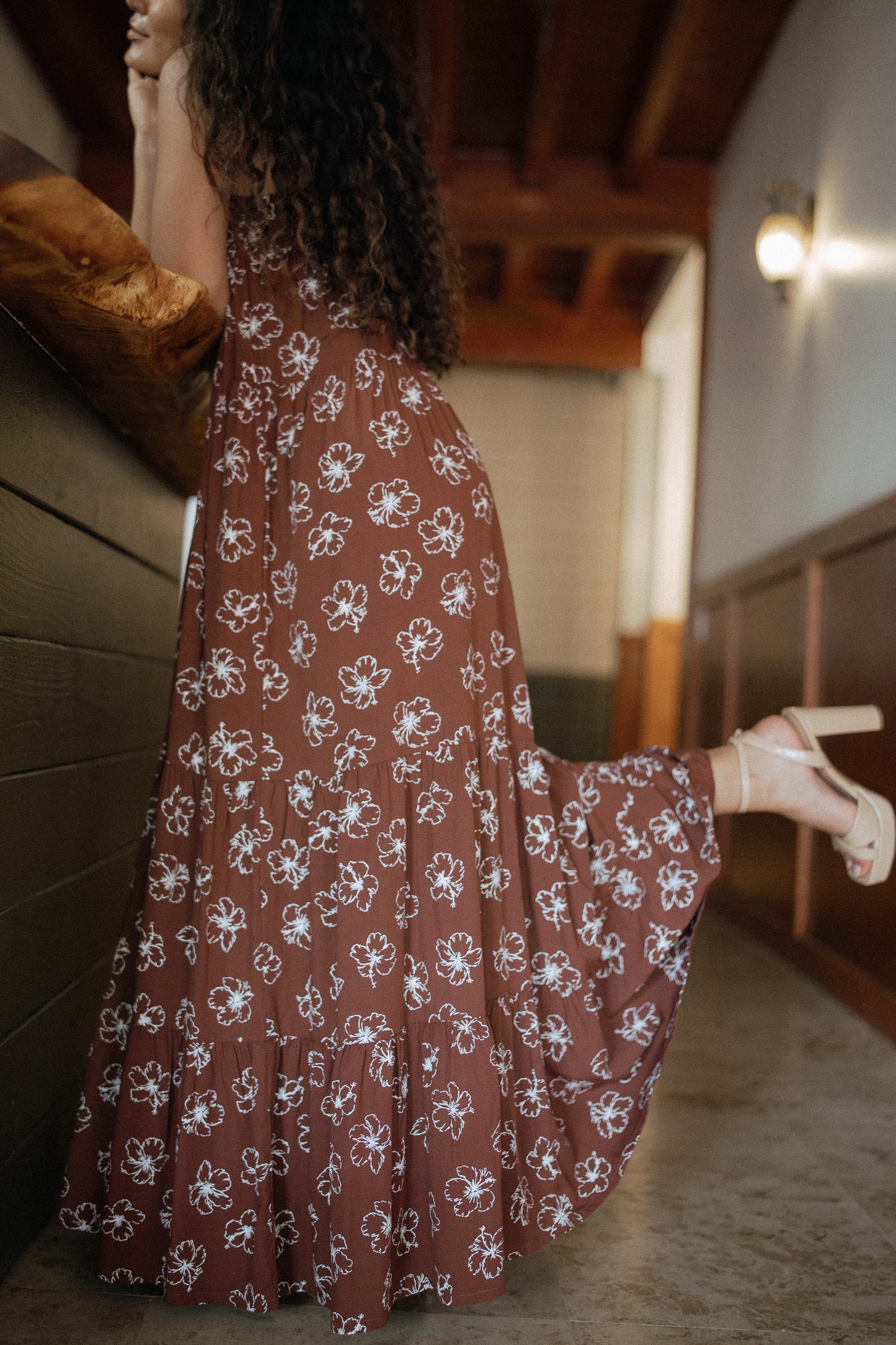 Waikiki Maxi Dress in Chocolate Bloom shown in motion as an easy vacation dress for warm-weather travel.