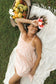 Overhead view of a woman wearing the Coconut Ave Waikiki Mini Dress in Pua Hou floral print, highlighting the tiered design, adjustable straps, and relaxed fit for resort wear.